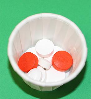 drug-resistant tuberculosis medication in a white paper cup