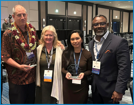 NTCA awardees Richard Brostrom (l) and Teresa Manalo (2nd from right) stand with NTCA Executive Director Donna Wegener and Guam TB Program Manager Chima Mbakwem. [photo courtesy of C. Mbakwem]