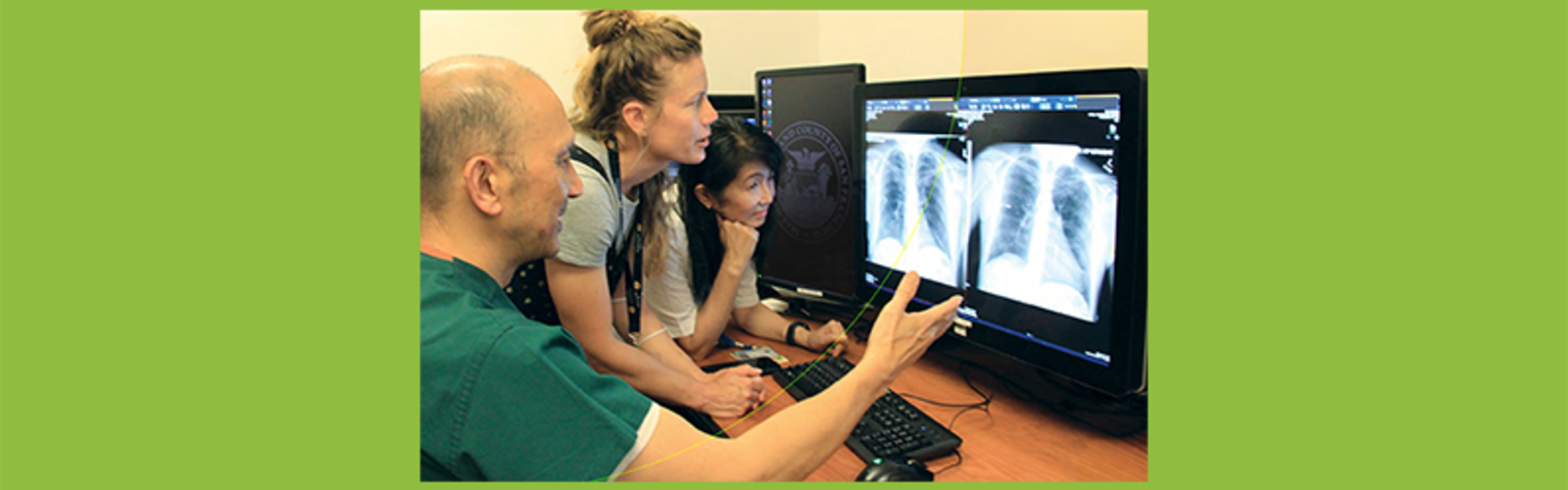 nurse practitioner in between two physicians examining chest radiographic images